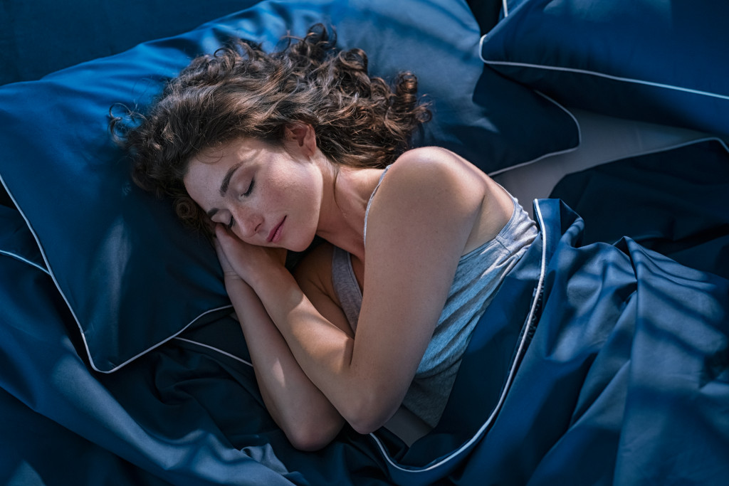 a woman in bed sleeping